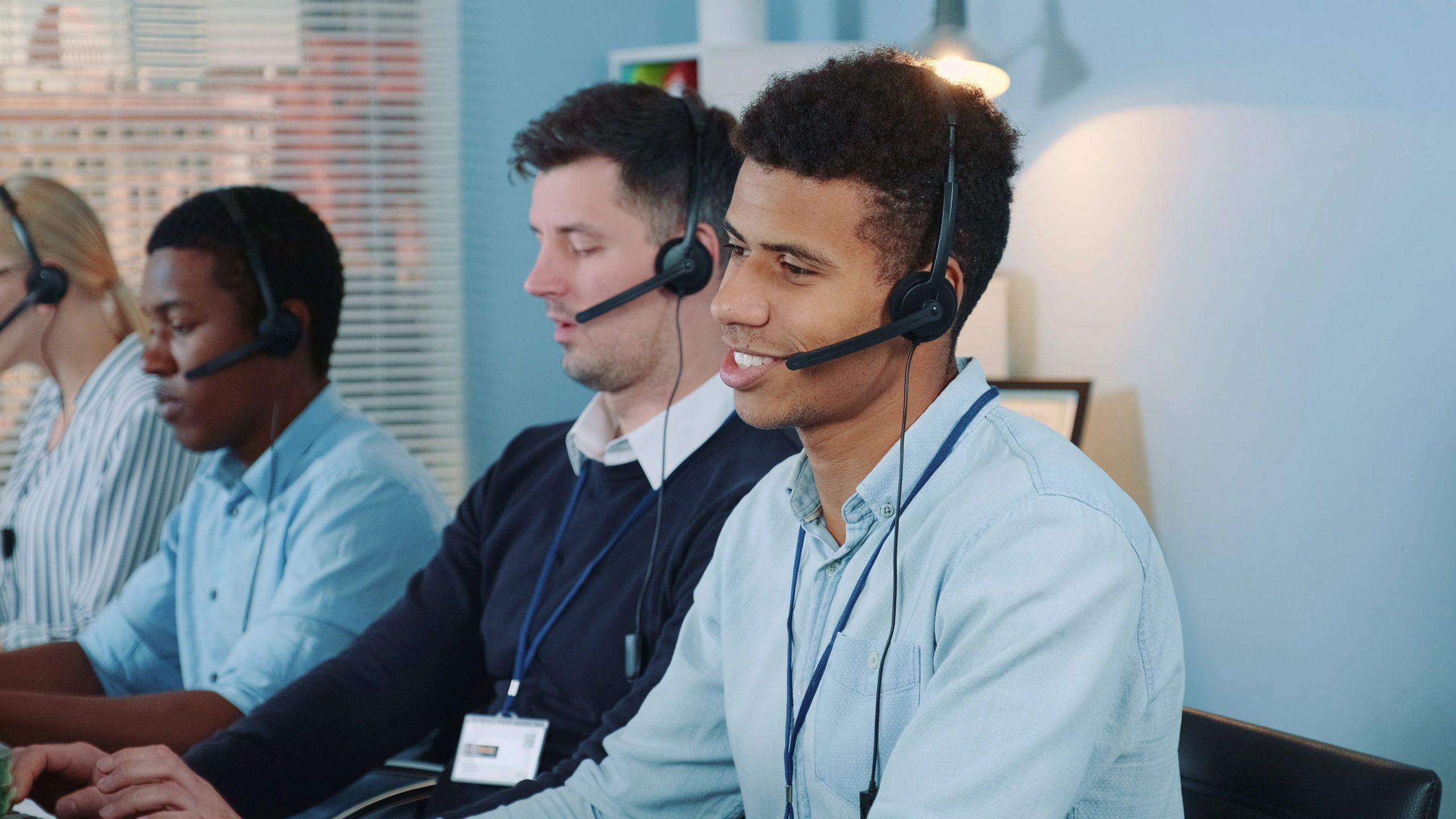 Collections specialist speaking with a client using a headset