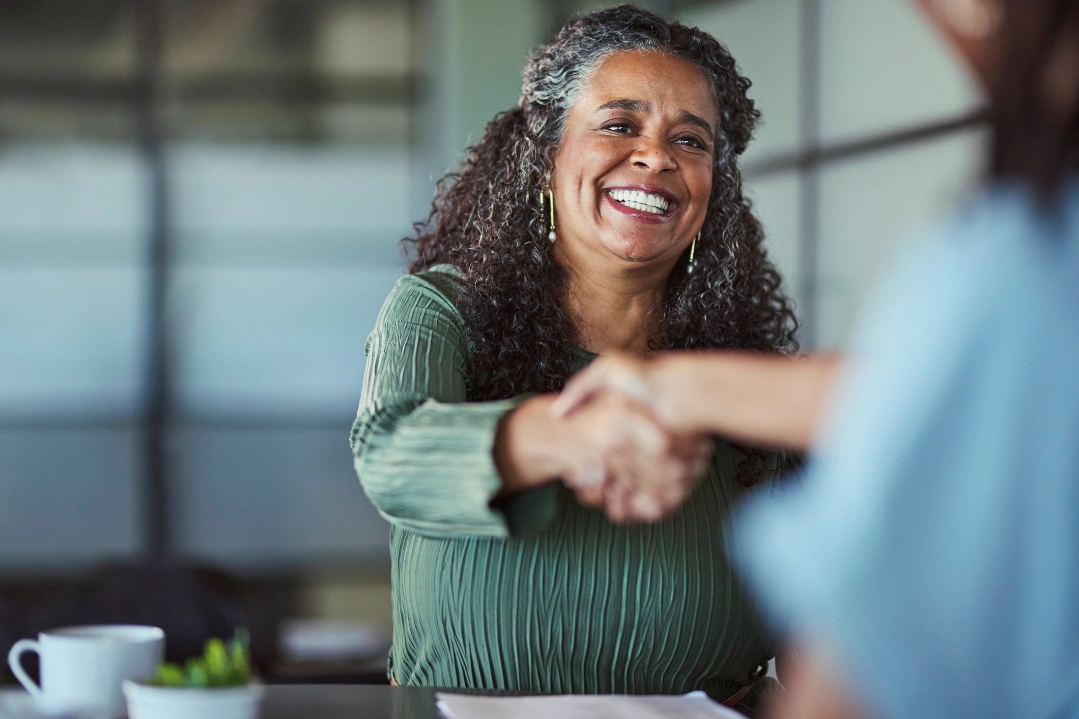 Business handshake representing professional commercial collections and resolution